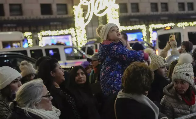 People arrive for the 92nd annual Rockefeller Center Christmas Tree lighting ceremony, Wednesday, Dec. 4, 2024, in New York. (AP Photo/Julia Demaree Nikhinson)