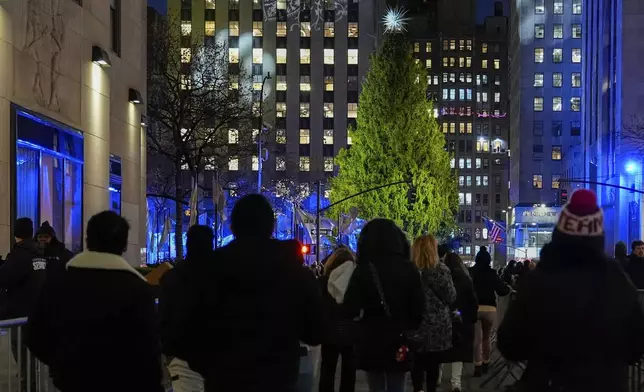People arrive for the 92nd annual Rockefeller Center Christmas Tree lighting ceremony, Wednesday, Dec. 4, 2024, in New York. (AP Photo/Julia Demaree Nikhinson)