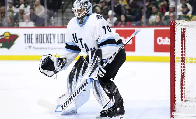 Utah Hockey Club goaltender Karel Vejmelka (70) defends his net against the Minnesota Wild during the first period of an NHL hockey game Friday, Dec. 20, 2024, in St. Paul, Minn. (AP Photo/Matt Krohn)