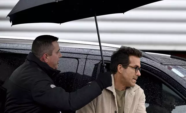 Wrexham co-owner Ryan Reynolds arrives at SToK Cae Ras, ahead of the English Football League One soccer match between Wrexham and Cambridge United, in Wrexham, Wales, Saturday Dec.14, 2024. (Cody Froggat/PA via AP)