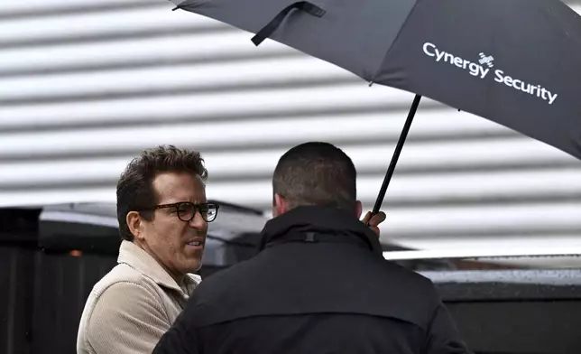 Wrexham co-owner Ryan Reynolds arrives at SToK Cae Ras, ahead of the English Football League One soccer match between Wrexham and Cambridge United, in Wrexham, Wales, Saturday Dec.14, 2024. (Cody Froggat/PA via AP)