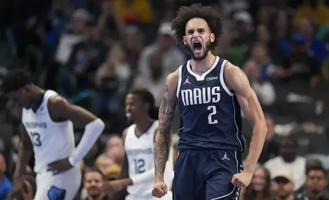 Dallas Mavericks center Dereck Lively II reacts after a basket after the game during the first half of an Emirates NBA Cup basketball game, Tuesday, Dec. 3, 2024, in Dallas. (AP Photo/Julio Cortez)