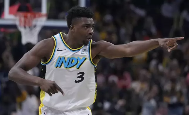 Indiana Pacers' Thomas Bryant reacts after hitting a basket during the first half of an NBA basketball game against the New Orleans Pelicans, Sunday, Dec. 15, 2024, in Indianapolis. (AP Photo/Darron Cummings)