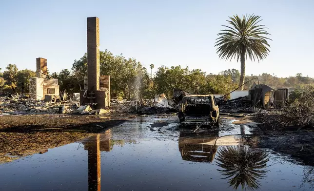 FILE - A chimney stands at a home destroyed by the Mountain Fire in Camarillo, Calif., on Nov. 8, 2024. (AP Photo/Noah Berger, File)