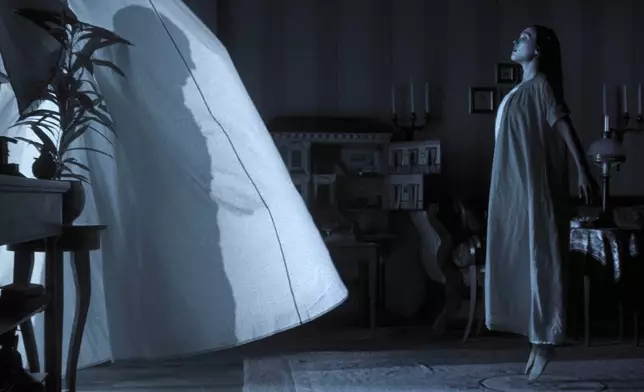 This image released by Focus Features shows Lily-Rose Depp in a scene from "Nosferatu." (Focus Features via AP)