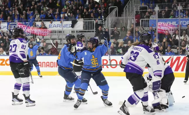 Toronto Sceptres' Victoria Bach (51) celebrates after scoring against the Minnesota Frost during the second period of a PWHL hockey game, Saturday, Dec. 7, 2024. (Chris Young/The Canadian Press via AP)