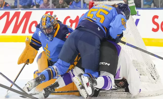 Minnesota Frost's Klara Hymlarova (71) is checked into the net by Toronto Sceptres' Rylind MacKinnon (55) as Sceptres goaltender Kristen Campbell (50) looks on during third period PWHL hockey action on Saturday, Dec. 7, 2024. (Chris Young/The Canadian Press via AP)