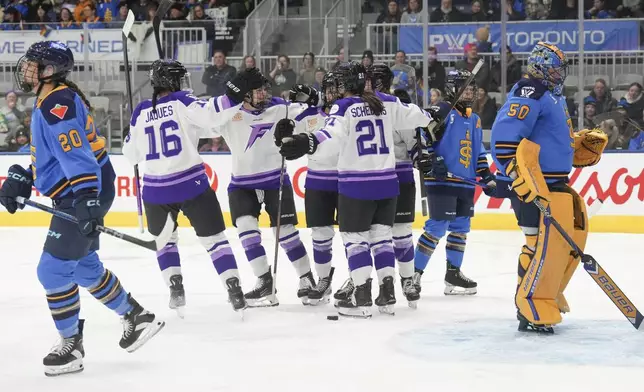 Minnesota Frost's Claire Butorac, center right, celebrates with teammates after scoring against Toronto Sceptres goaltender Kristen Campbell (50) during the first period of a PWHL hockey game, Saturday, Dec. 7, 2024. (Chris Young/The Canadian Press via AP)
