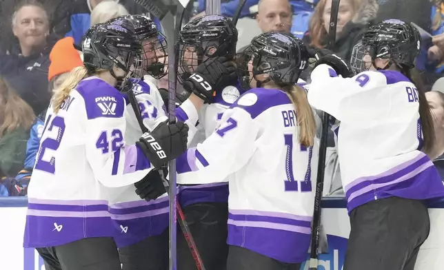 Minnesota Frost's Britta Curl, centre, celebrates with teammates after scoring against Toronto Sceptres during third period PWHL hockey action on Saturday, Dec. 7, 2024. (Chris Young/The Canadian Press via AP)