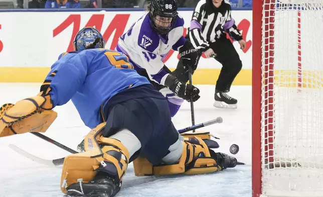 Minnesota Frost's Michela Cava (86) shoots on Toronto Sceptres goaltender Kristen Campbell (50) during the first period of a PWHL hockey game, Saturday, Dec. 7, 2024. (Chris Young/The Canadian Press via AP)
