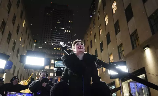 Kelly Clarkson reacts to snow during the 92nd annual Rockefeller Center Christmas tree lighting ceremony, Wednesday, Dec. 4, 2024, in New York. (AP Photo/Julia Demaree Nikhinson)