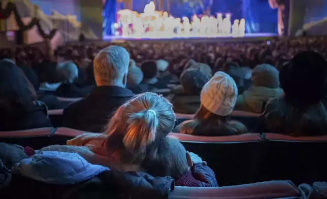 People watch the Christmas Spectacular Starring the Radio City Rockettes at Radio City Music Hall, Friday, Dec. 13, 2024, in New York. (AP Photo/Julia Demaree Nikhinson)