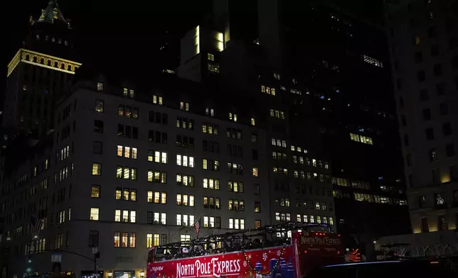 Topview's North Pole Express bus moves along Fifth Avenue, Saturday, Dec. 14, 2024, in New York. (AP Photo/Julia Demaree Nikhinson)