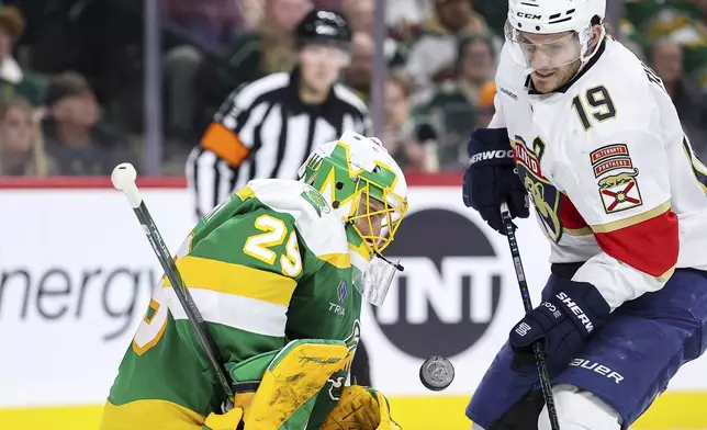 Minnesota Wild goaltender Marc-Andre Fleury (29) makes a save on a shot by Florida Panthers left wing Matthew Tkachuk (19) during the second period of an NHL hockey game Wednesday, Dec. 18, 2024, in St. Paul, Minn. (AP Photo/Matt Krohn)