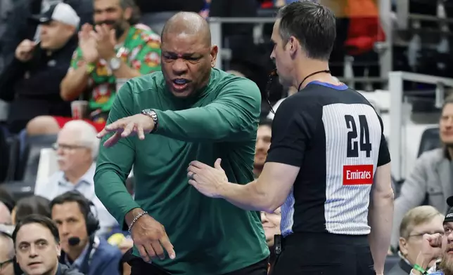 Milwaukee Bucks head coach Doc Rivers argues a call with referee Kevin Scott (24) during the first half of an Emirates NBA Cup basketball game against the Detroit Pistons, Tuesday, Dec. 3, 2024, in Detroit. (AP Photo/Duane Burleson)