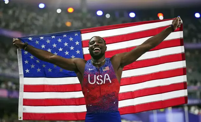 FILE - Noah Lyles, of the United States, celebrates after winning the men's 100-meter final at the 2024 Summer Olympics, Sunday, Aug. 4, 2024, in Saint-Denis, France. (AP Photo/Petr David Josek, File)