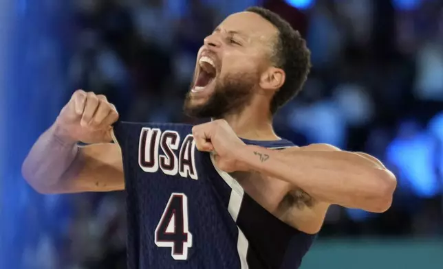 FILE - United States' Stephen Curry (4) celebrates after beating France to win the gold medal during a men's gold medal basketball game at Bercy Arena at the 2024 Summer Olympics, Saturday, Aug. 10, 2024, in Paris, France. (AP Photo/Mark J. Terrill, File)