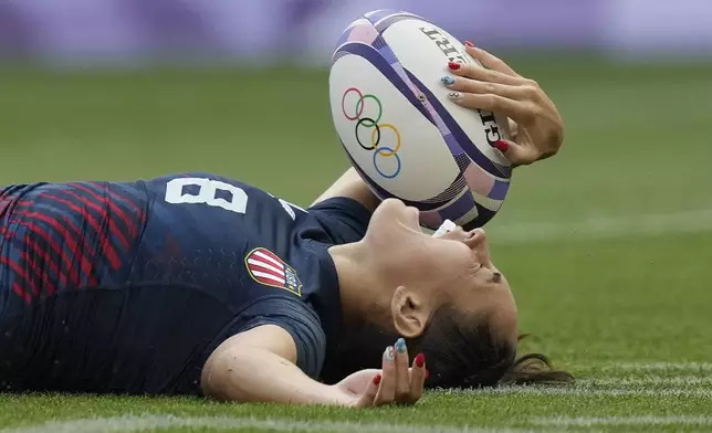 FILE 0- United States' Alex Sedrick reacts after scoring the winning try during the women's bronze medal Rugby Sevens match between the United States and Australia at the 2024 Summer Olympics, in the Stade de France, in Saint-Denis, France, Tuesday, July 30, 2024.. (AP Photo/Vadim Ghirda, File)