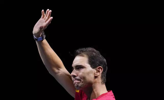 FILE - Spain's Rafael Nadal waves to the crowd during a tribute after playing his last match as a professional in the Davis Cup quarterfinals at the Martin Carpena Sports Hall in Malaga, southern Spain, early Wednesday, Nov. 20, 2024. (AP Photo/Manu Fernandez, File)