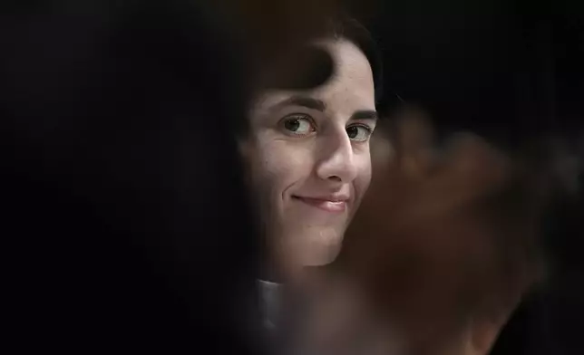 FILE - Iowa's Caitlin Clark looks on during a news conference announcing the AP NCAA Women's Coach and Player of the Year Thursday, April 4, 2024, in Cleveland. (AP Photo/Carolyn Kaster, File)