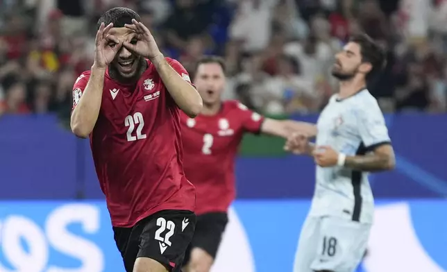 FILE - Georgia's Georges Mikautadze celebrates after scoring on a penalty kick during a Group F match between Georgia and Portugal at the Euro 2024 soccer tournament in Gelsenkirchen, Germany, Wednesday, June 26, 2024. (AP Photo/Martin Meissner, File)