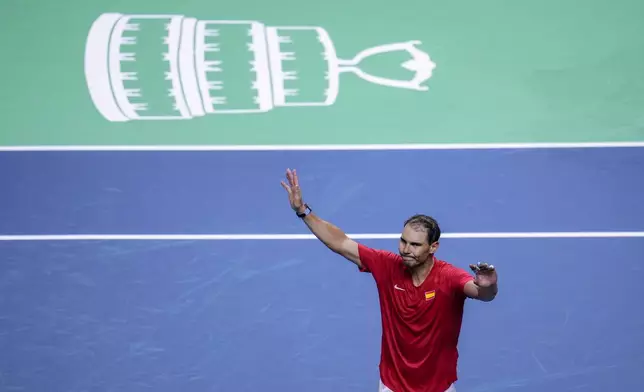 FILE - Spain's tennis player Rafael Nadal waves to the crowd after losing against Netherlands' Botic Van De Zandschulp during a Davis Cup quarterfinal match at Martin Carpena Sports Hall in Malaga, southern Spain, on Tuesday, Nov. 19, 2024. (AP Photo/Manu Fernandez, File)