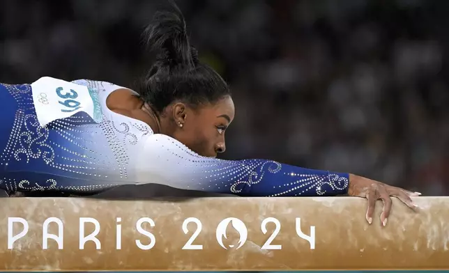 FILE - Simone Biles, of the United States, competes during the women's artistic gymnastics individual balance beam finals at Bercy Arena at the 2024 Summer Olympics, Monday, Aug. 5, 2024, in Paris, France. (AP Photo/Francisco Seco, File)