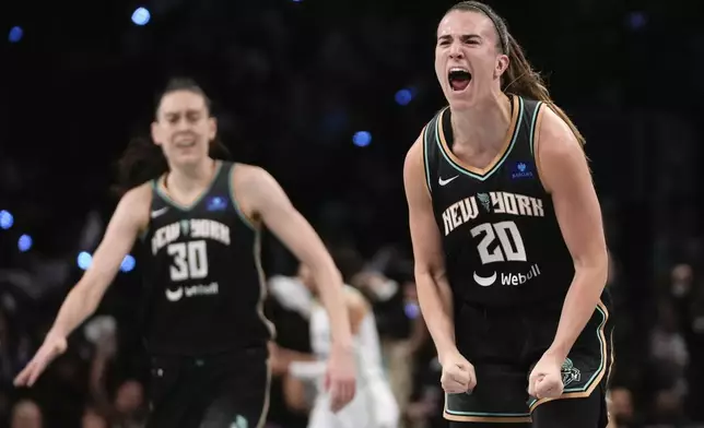 FILE - New York Liberty guard Sabrina Ionescu (20) reacts after scoring against the Minnesota Lynx during the third quarter of Game 5 of the WNBA basketball final series, Sunday, Oct. 20, 2024, in New York. (AP Photo/Pamela Smith, File)