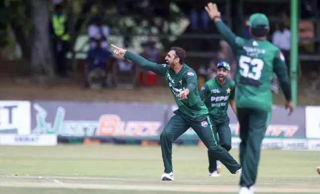 Pakistan's Salman Ali Agha celebrates the taking of a wicket during the second T20 cricket match between Zimbabwe and Pakistan at Queens Sports Club in Bulawayo, Zimbabwe, Tuesday, Dec. 3, 2024. (AP Photo/Wonder Mashura)