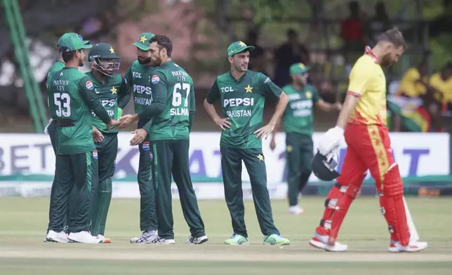 Pakistan celebrates the taking of Zimbabwe's Ryan Burl during the second T20 cricket match between Zimbabwe and Pakistan at Queens Sports Club in Bulawayo, Zimbabwe, Tuesday, Dec. 3, 2024. (AP Photo/Wonder Mashura)