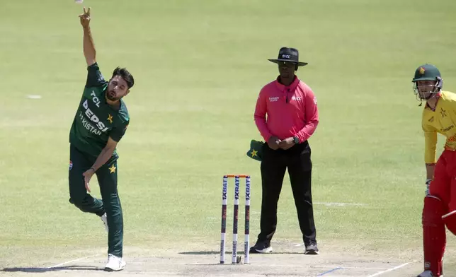 Pakistan's Abrar Ahmed bowls during the second T20 cricket match between Zimbabwe and Pakistan at Queens Sports Club in Bulawayo, Zimbabwe, Tuesday, Dec. 3, 2024. (AP Photo/Wonder Mashura)