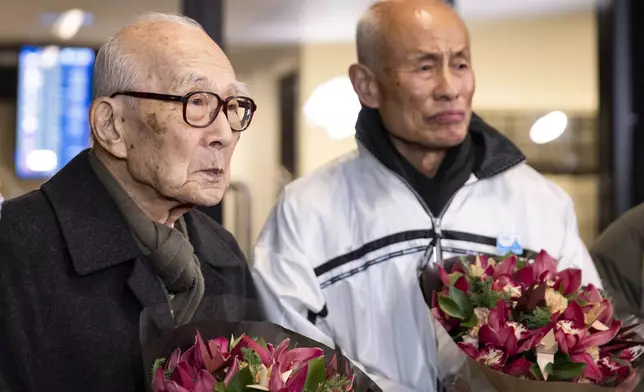 Representatives of this year's Nobel Peace Prize winner Nihon Hidankyo Terumi Tanaka, left, and Toshiyuki Mimaki arrive in Gardermoen, Norway Sunday evening, Dec. 8, 2024. (Amanda Pedersen Giske/NTB Scanpix via AP)