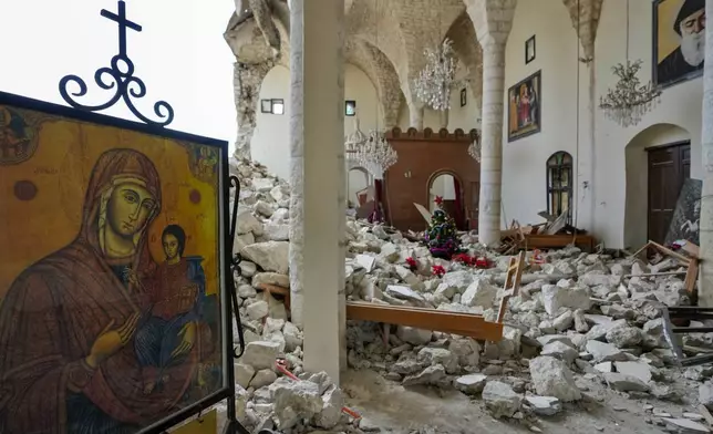 Icons are seen inside St. George Melkite Catholic Church, that was destroyed by Israeli airstrike, in the town of Dardghaya in southern Lebanon, Sunday, Dec. 22, 2024. (AP Photo/Hassan Ammar)