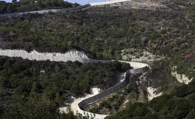 A general view the border wall between Israel and Lebanon as seen from northern Israel, Friday, Dec. 6, 2024. (AP Photo/Matias Delacroix)