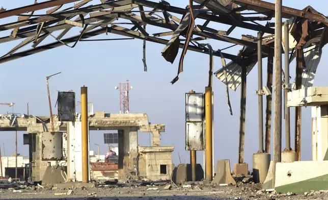 The destroyed crossing border point between Lebanon and Syria which hit by an Israeli airstrike is shown, in Arida, north Lebanon, Friday, Dec. 6, 2024. (AP Photo)