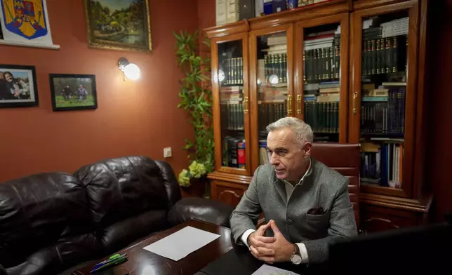 Calin Georgescu, the independent candidate for presidency who won the first round of presidential elections, speaks after an interview with the Associated Press in Izvorani, Romania, Wednesday, Dec. 4, 2024. (AP Photo/Vadim Ghirda)