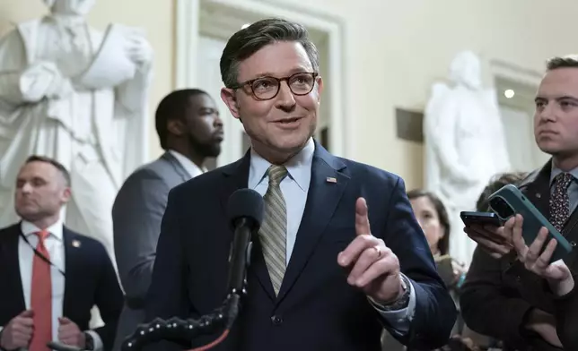 Speaker of the House Mike Johnson, R-La., talks to reporters after passing the funding bill to avert the government shutdown at the Capitol in Washington, Friday, Dec. 20, 2024. (AP Photo/Jose Luis Magana)