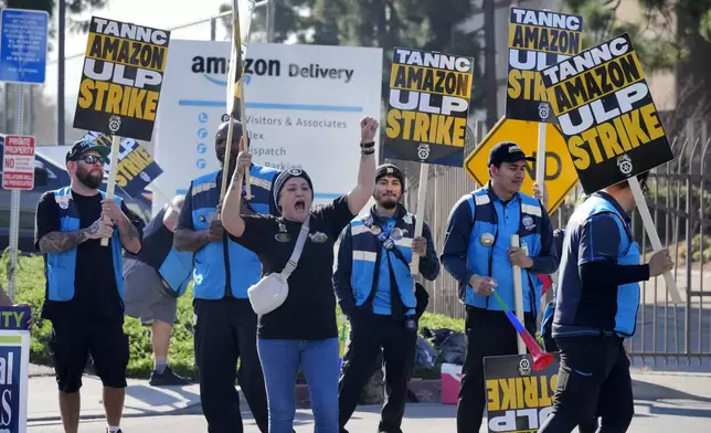 Amazon workers strike outside the gates of an Amazon Fulfillment Center as Teamsters seek labor contract nationwide Friday, Dec. 20, 2024, in City of Industry, Calif. (AP Photo/Damian Dovarganes)