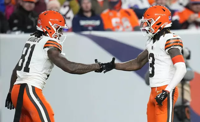 Cleveland Browns wide receiver Jerry Jeudy (3) celebrates his 70-yard pass reception for a touchdown with wide receiver Michael Woods II (81) during the second half of an NFL football game against the Denver Broncos, Monday, Dec. 2, 2024, in Denver. (AP Photo/Jack Dempsey)