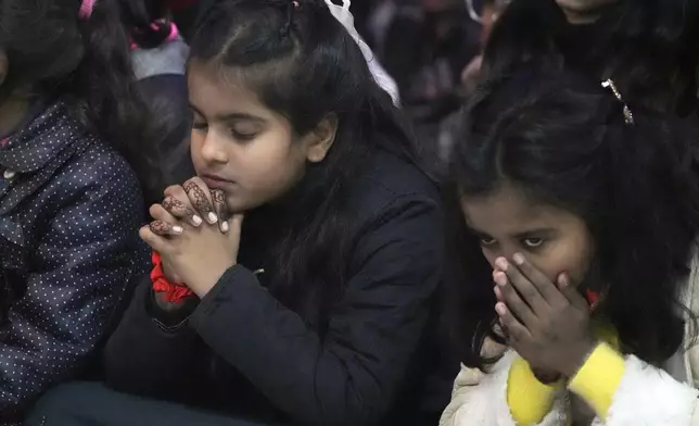 Pakistani Christians attend midnight Christmas Mass at St. Anthony's church in Lahore, Pakistan, Wednesday, Dec. 25, 2024. (AP Photo/K.M. Chaudary)