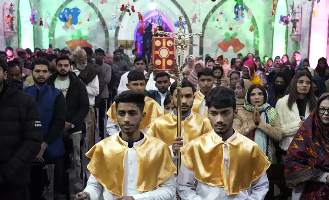 Pakistani Christians attend midnight Christmas Mass at St. Anthony's church in Lahore, Pakistan, Wednesday, Dec. 25, 2024. (AP Photo/K.M. Chaudary)