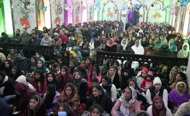 Pakistani Christians attend midnight Christmas Mass at St. Anthony's church in Lahore, Pakistan, Wednesday, Dec. 25, 2024. (AP Photo/K.M. Chaudary)