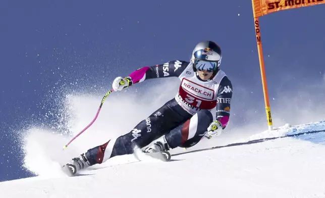 United States' Lindsey Vonn competes in an alpine ski, women's World Cup super G, in St. Moritz, Switzerland, Saturday, Dec. 21, 2024. (Jean-Christophe Bott/Keystone via AP)