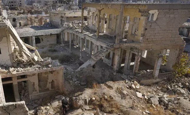 A Syrian man observes the destroyed Jobar Synagogue, also known as Eliyahu Hanavi, in Jobar neighborhood, in Damascus, Syria, Wednesday, Dec. 25, 2024. (AP Photo/Hussein Malla)