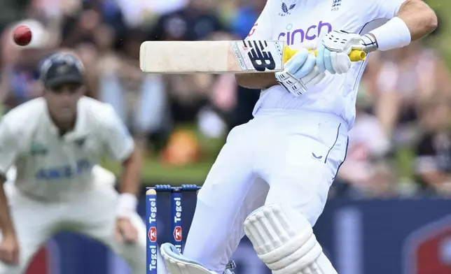 England's Joe Root bats during play on day two of the third cricket test between England and New Zealand in Hamilton, New Zealand, Sunday, Dec. 15, 2024. (Andrew Cornaga/Photosport via AP)