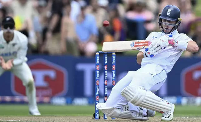 England's Ollie Pope bats during play on day two of the third cricket test between England and New Zealand in Hamilton, New Zealand, Sunday, Dec. 15, 2024. (Andrew Cornaga/Photosport via AP)