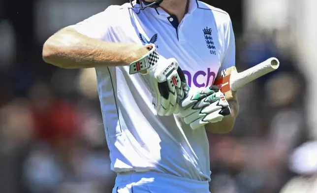 England's Zak Crawley reacts as he walks from the field after he was dismissed during play on day two of the third cricket test between England and New Zealand in Hamilton, New Zealand, Sunday, Dec. 15, 2024. (Andrew Cornaga/Photosport via AP)