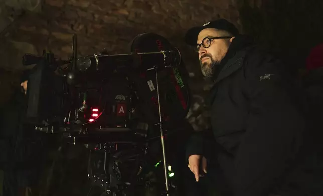 This image released by Focus Features shows director Robert Eggers on the set of "Nosferatu." (Focus Features via AP)