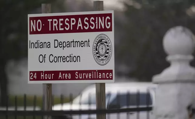 A sign is posted outside of Indiana State Prison where, barring last-minute court action or intervention by Gov. Eric Holcomb, Joseph Corcoran, 49, convicted in the 1997 killings of his brother and three other people, is scheduled to be put to death by lethal injection before sunrise Tuesday, Dec. 17, 2024, in Michigan City, Ind. (AP Photo/Erin Hooley)