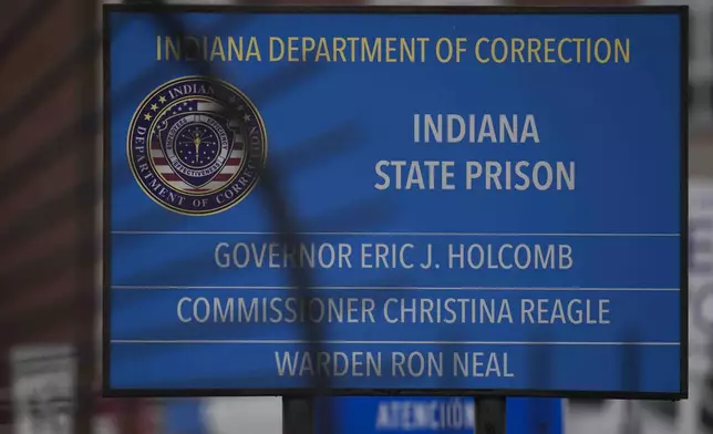 A sign is posted outside of Indiana State Prison where, barring last-minute court action or intervention by Gov. Eric Holcomb, Joseph Corcoran, 49, convicted in the 1997 killings of his brother and three other people, is scheduled to be put to death by lethal injection before sunrise Tuesday, Dec. 17, 2024, in Michigan City, Ind. (AP Photo/Erin Hooley)